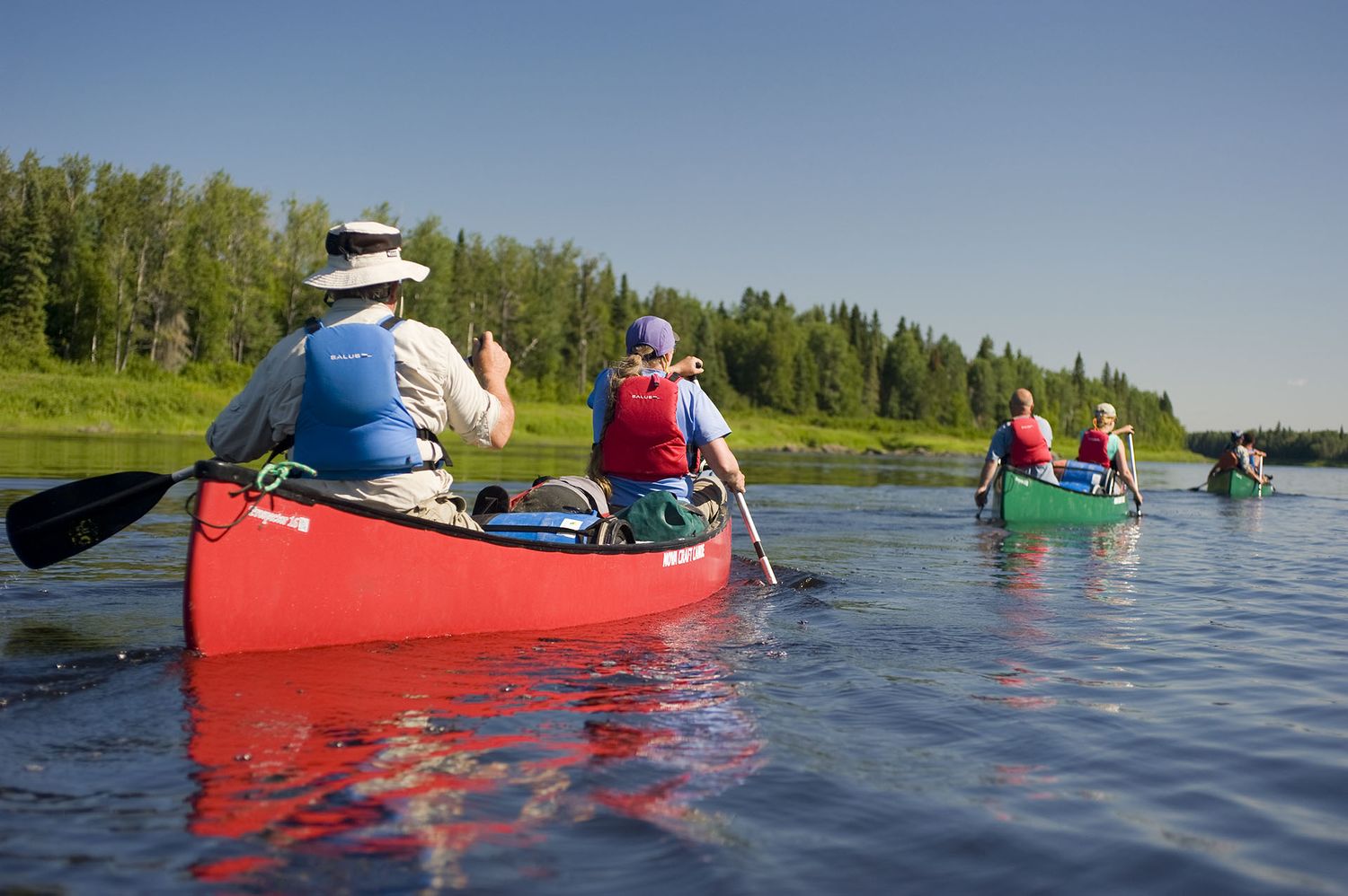 Canoes paddling down the Missinaibi River